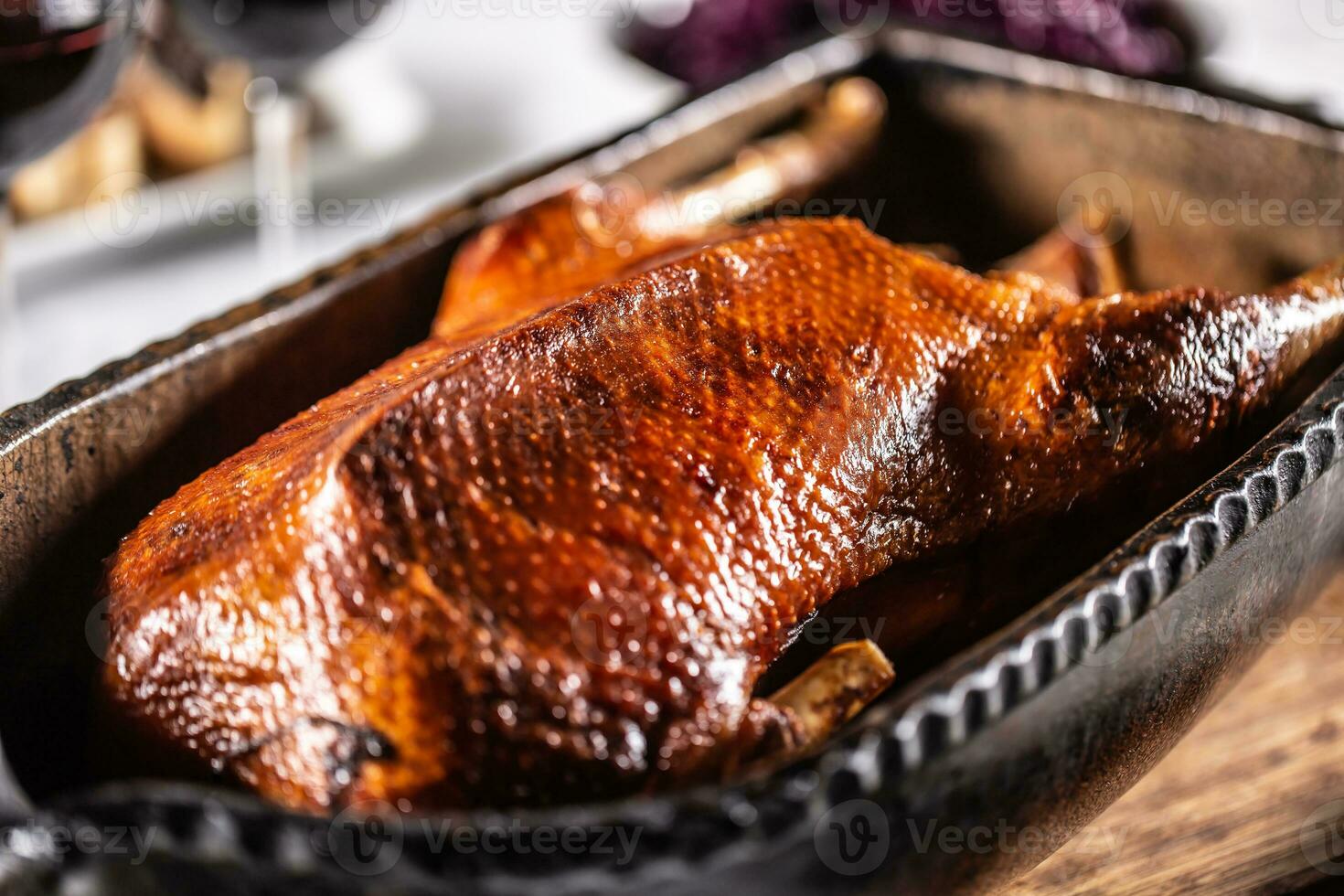 Traditionally roasted goose in an original baking dish photo