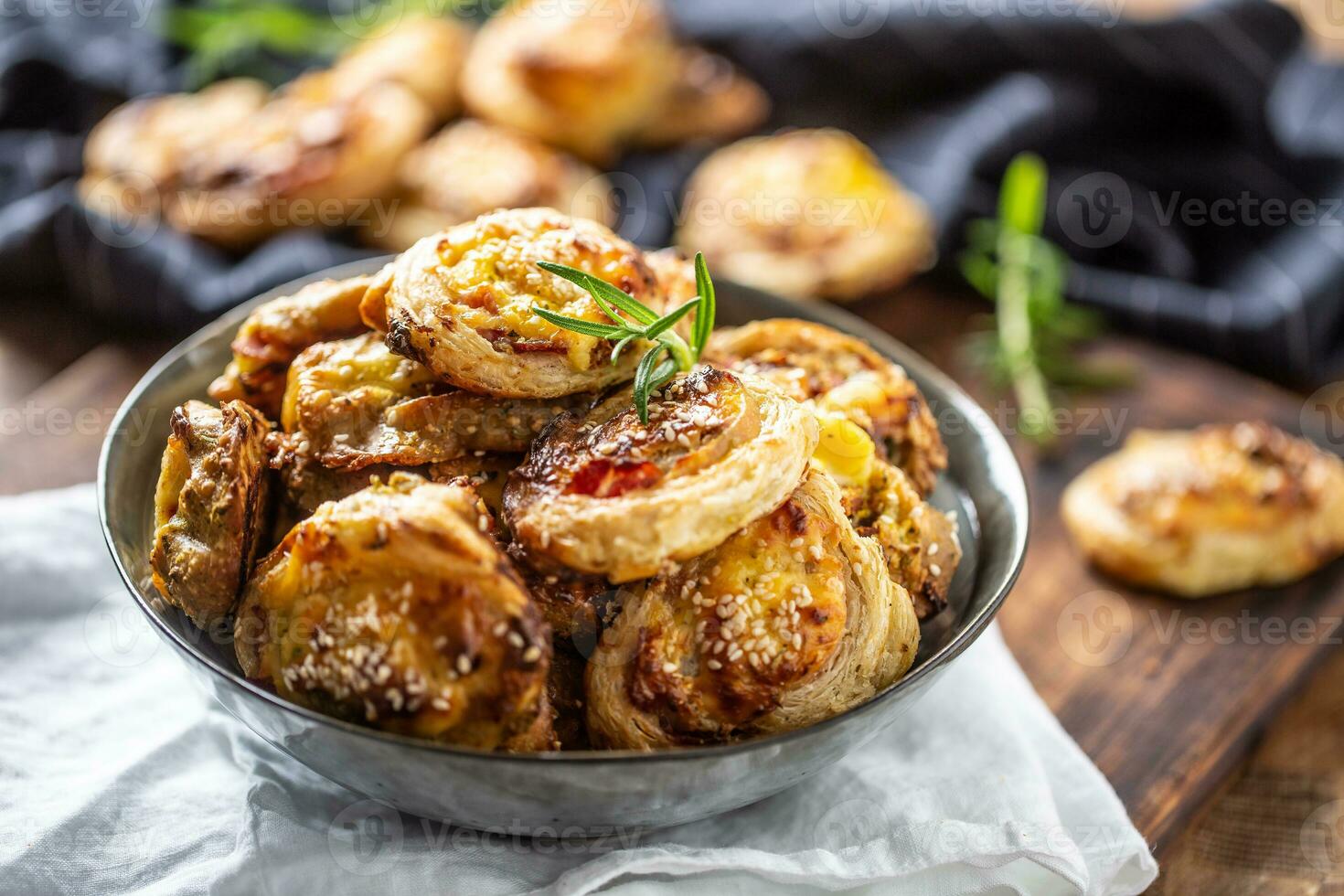 Pizza rolls stuffed with various ingredients, prosciutto bacon spinach basil mozzarella or parmesan cheese photo