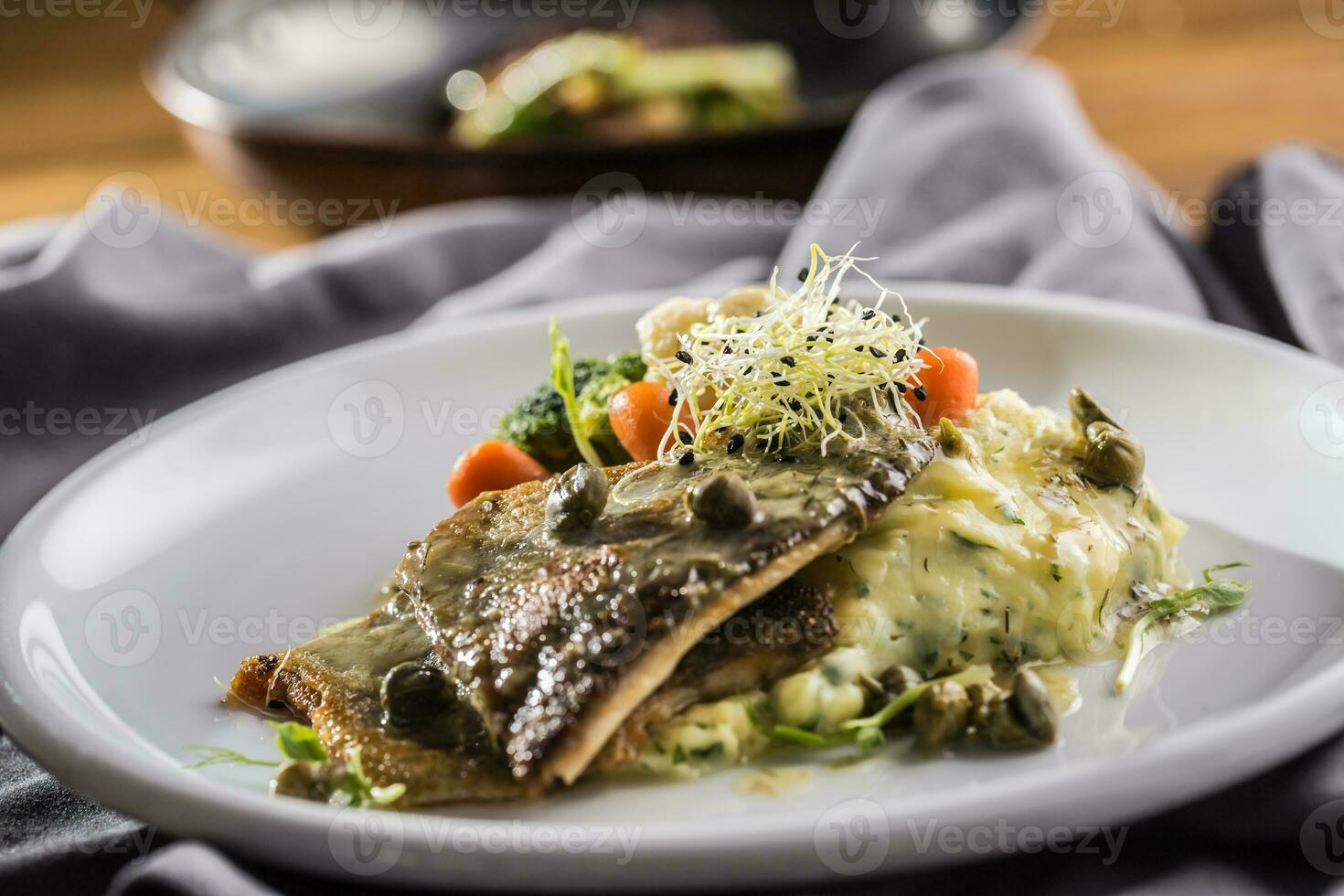 Baked trout fillet with mashed potatoes and draft beer photo