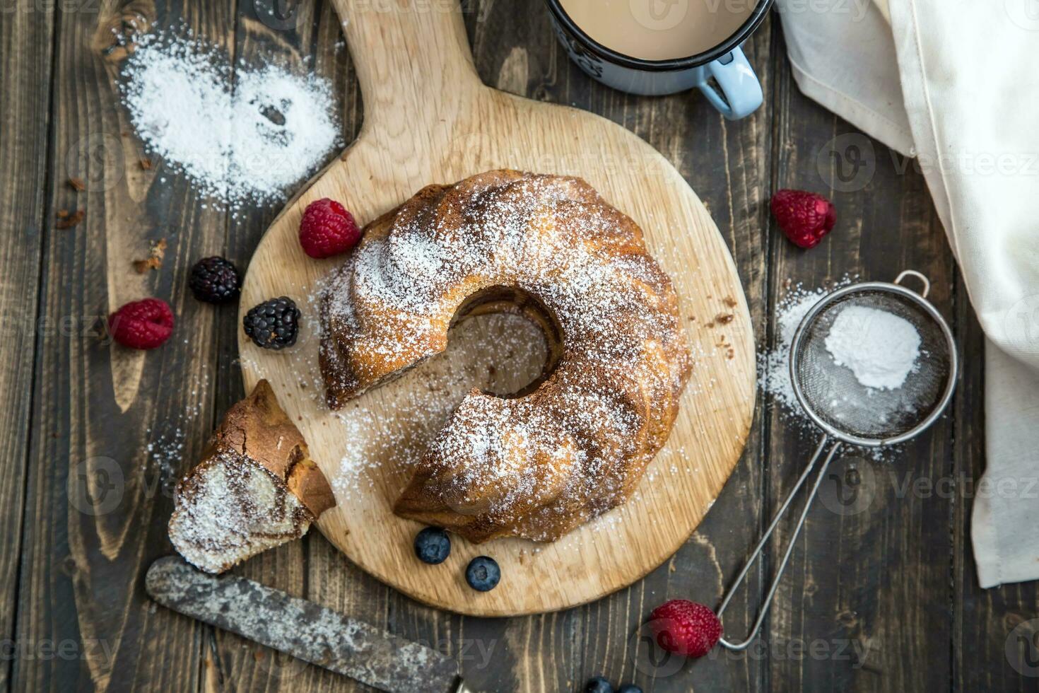 Cake. Marble cake cup of coffee powder sugar kitchen vintage utensil and fresh fruit berries photo