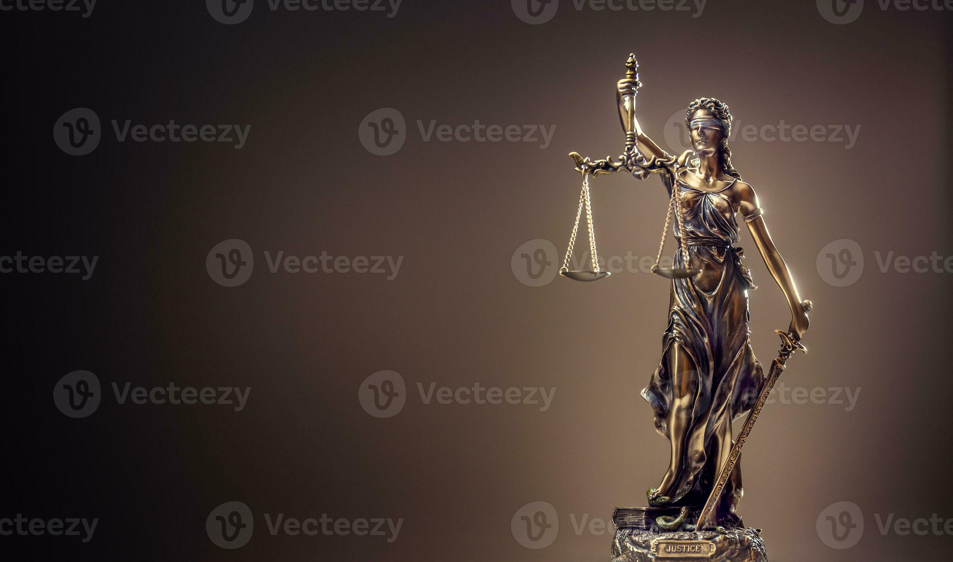 Statute of Justice. Bronze statue Lady Justice holding scales and sword