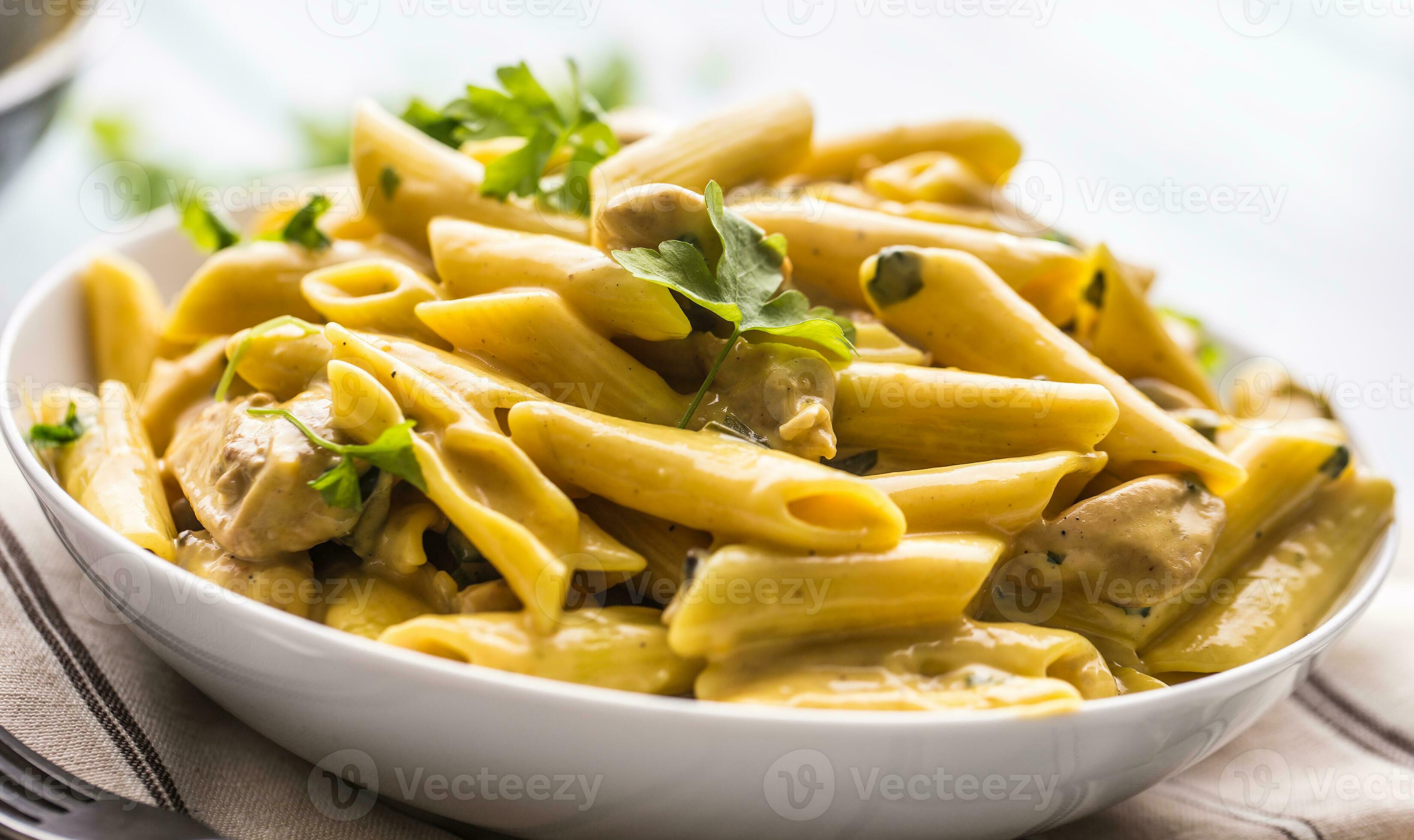 Pasta pene with chicken pieces mushrooms parmesan cheese sauce and herb  decoration. Pene con pollo - Italian or medierranean cuisine 27485786 Stock  Photo at Vecteezy