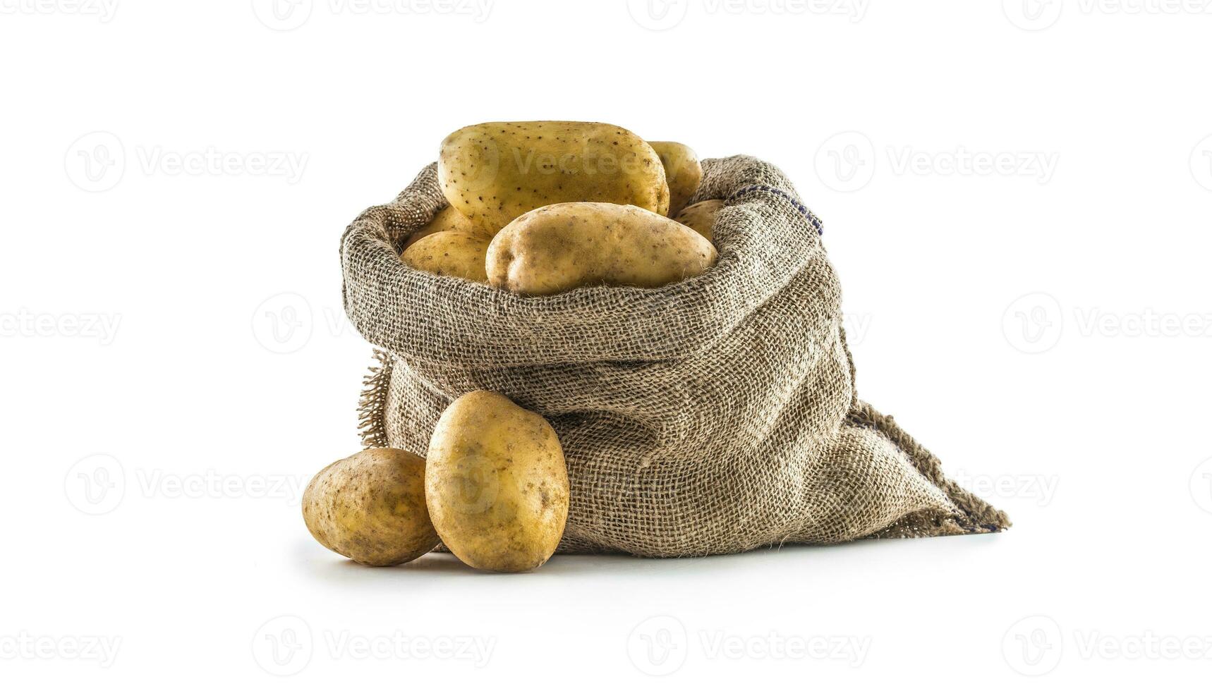 New potatoes in burlap sack isolated on white. photo