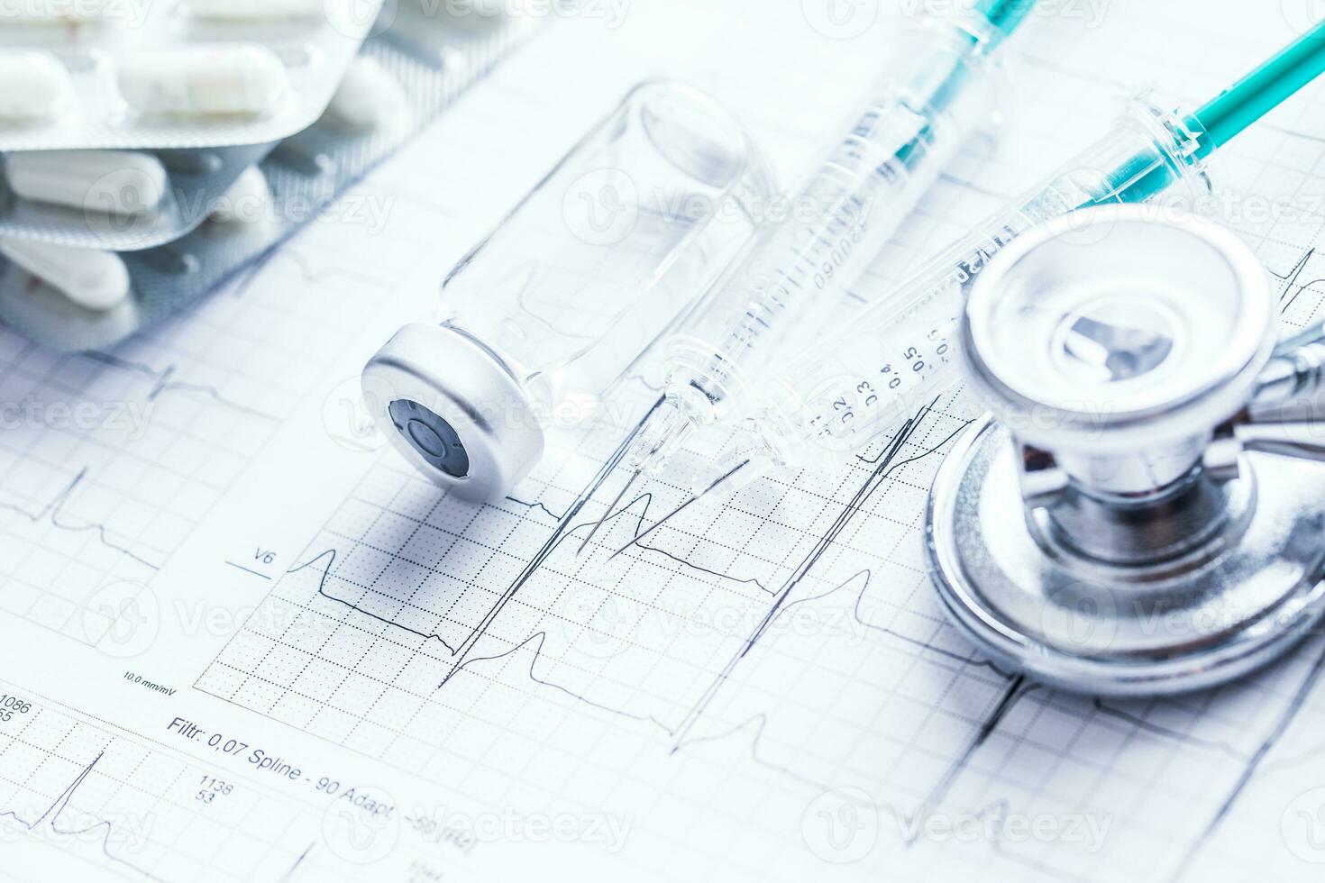 Stethoscope injections pills on the  EKG graph. photo