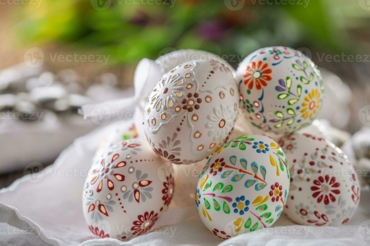 Handmade colorful easter eggs on a linen napkin. photo