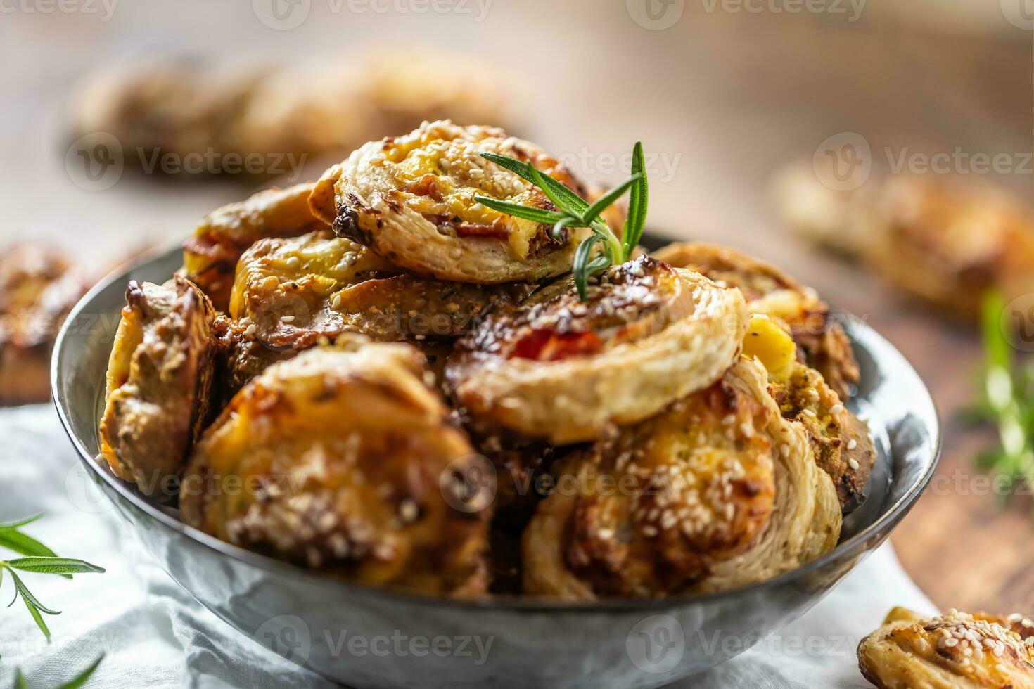 Pizza rolls stuffed with various ingredients, prosciutto bacon spinach basil mozzarella or parmesan cheese photo