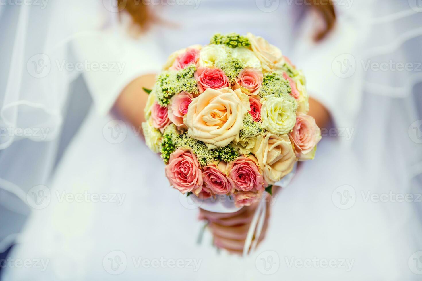 Wedding bouquet. wedding bouquet with roses in hands of bride photo