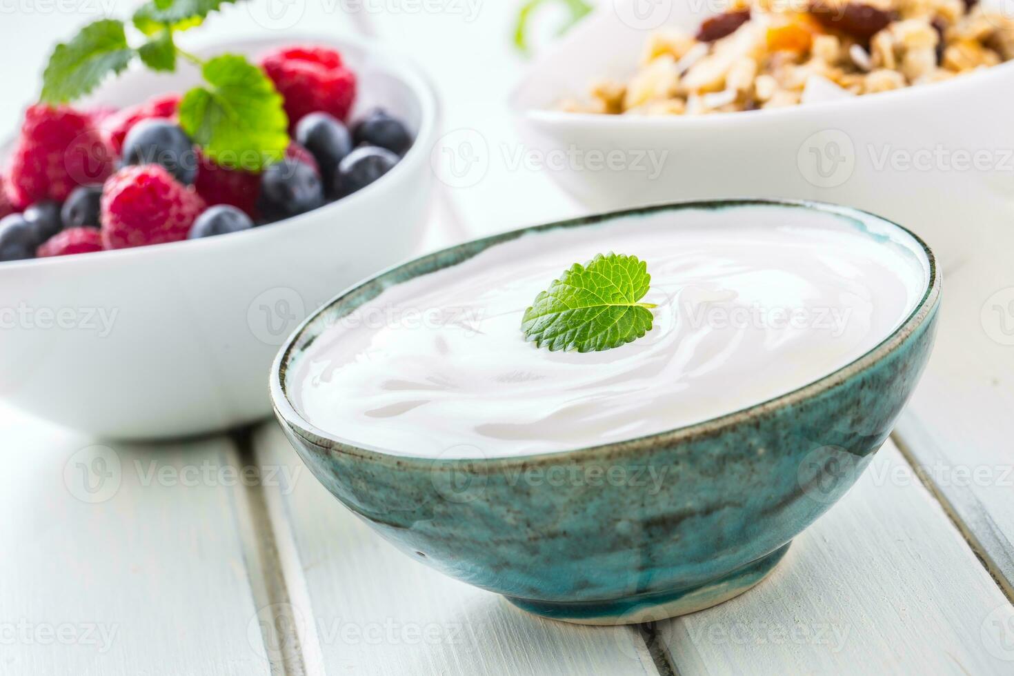 Muesli yoghurt and berries. Healthy breakfast with yogurt granola and fresh fruit photo