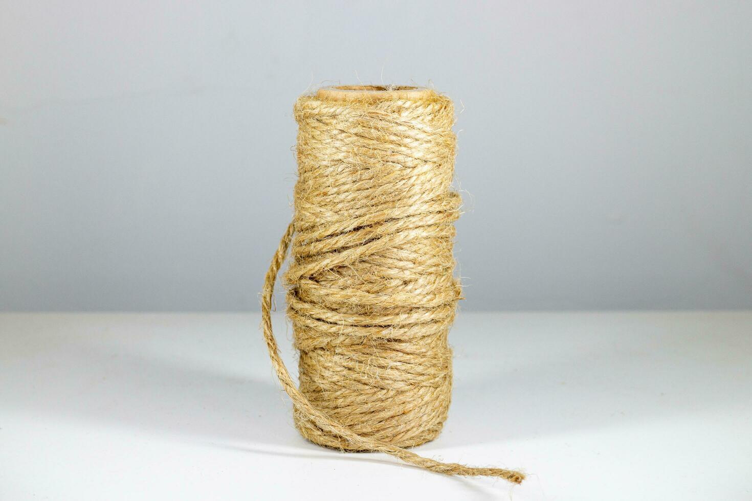 Roll of twine isolated on white background. Close up, selective focus. photo