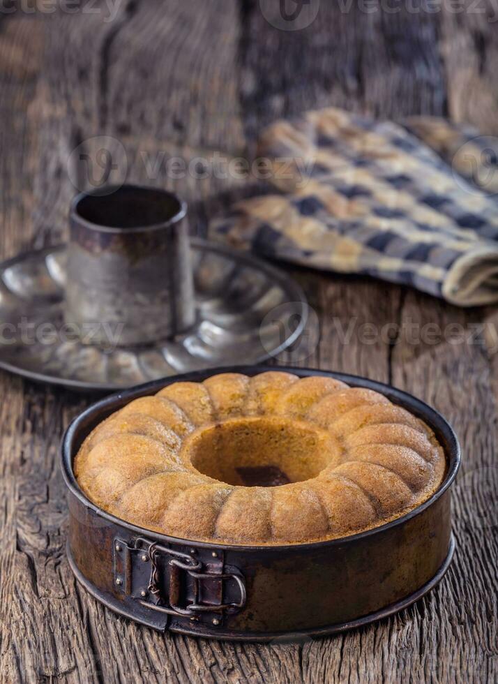 Marble cake.Easter Cake. Marble cake cup of coffee powder sugar and kitchen vintage utensil. photo