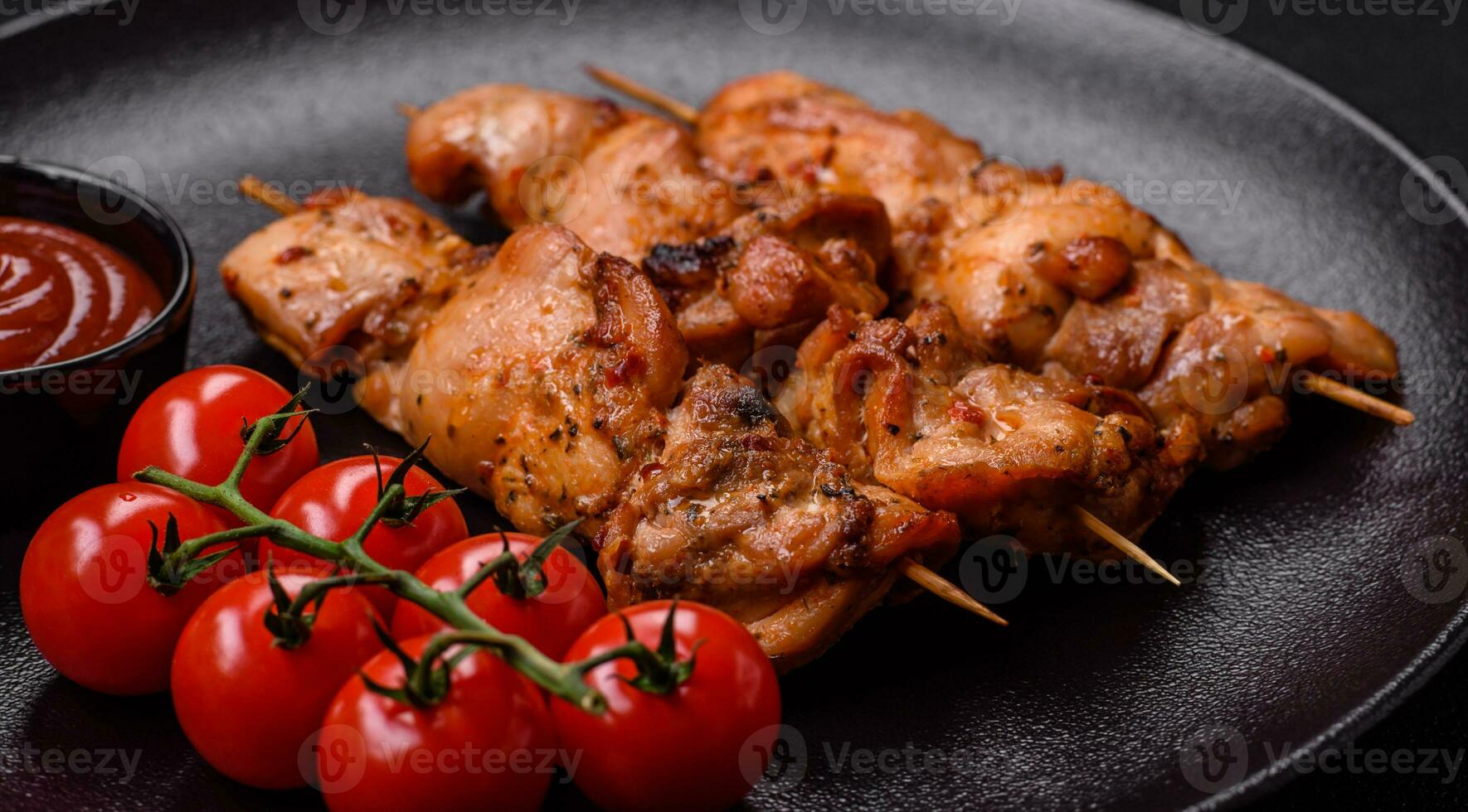 Delicious fresh, juicy chicken or pork kebab on skewers with salt and spices photo