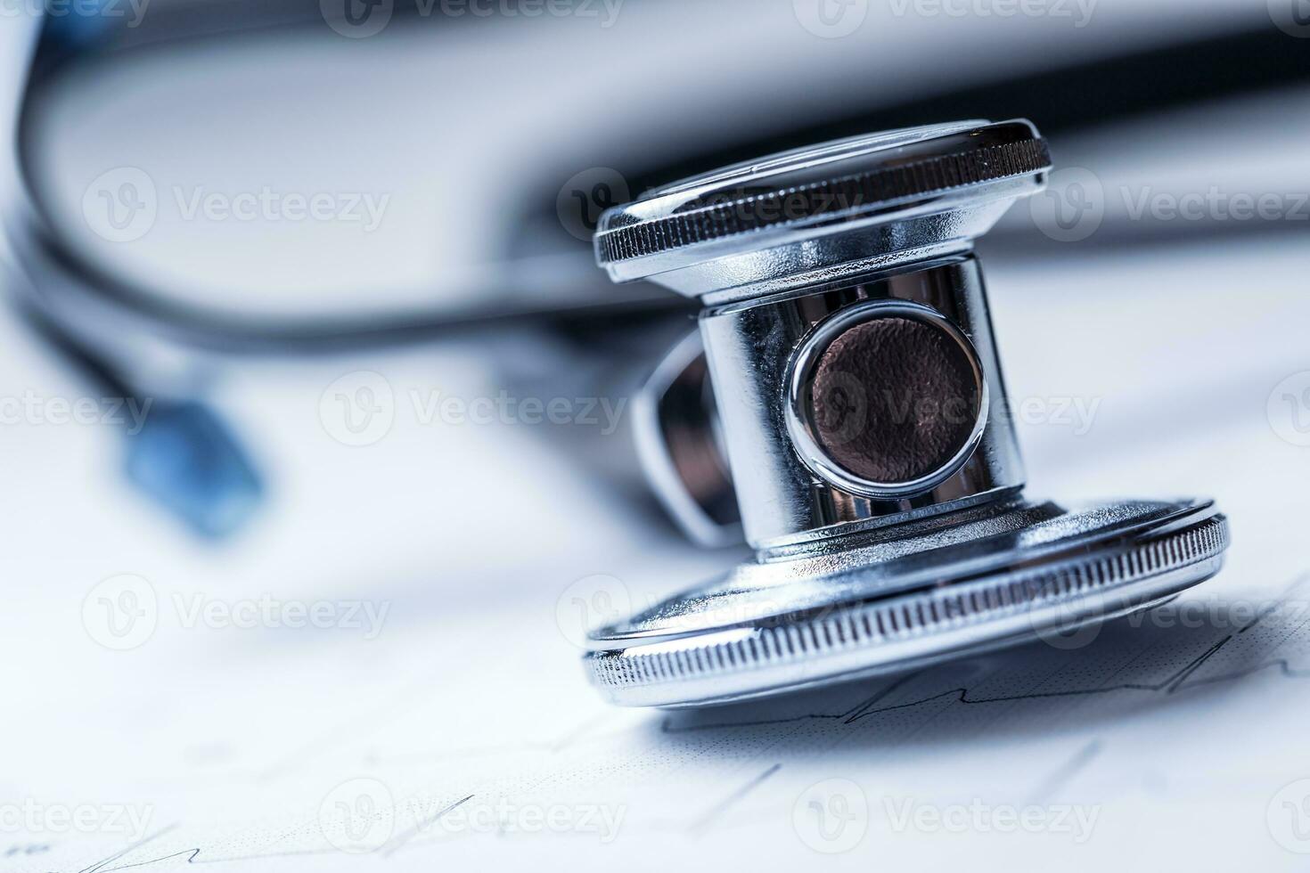 Stethoscope on a heart monitor printout.Electrocardiogram chart and stethoscope. photo