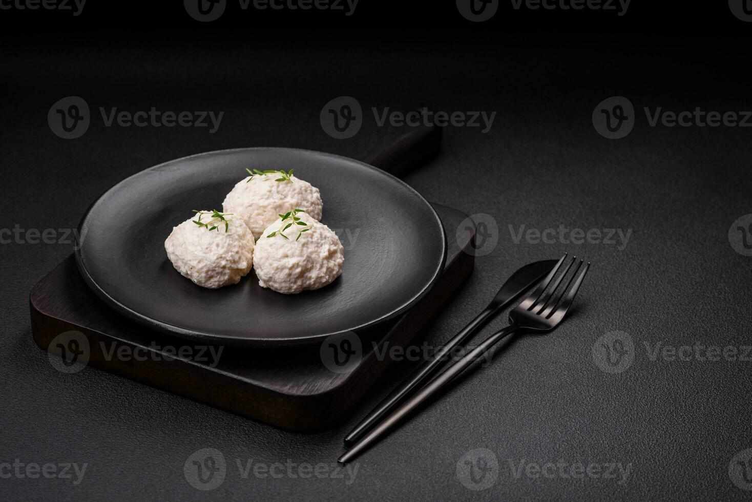 Delicious healthy steamed chicken cutlets or minced meatballs photo