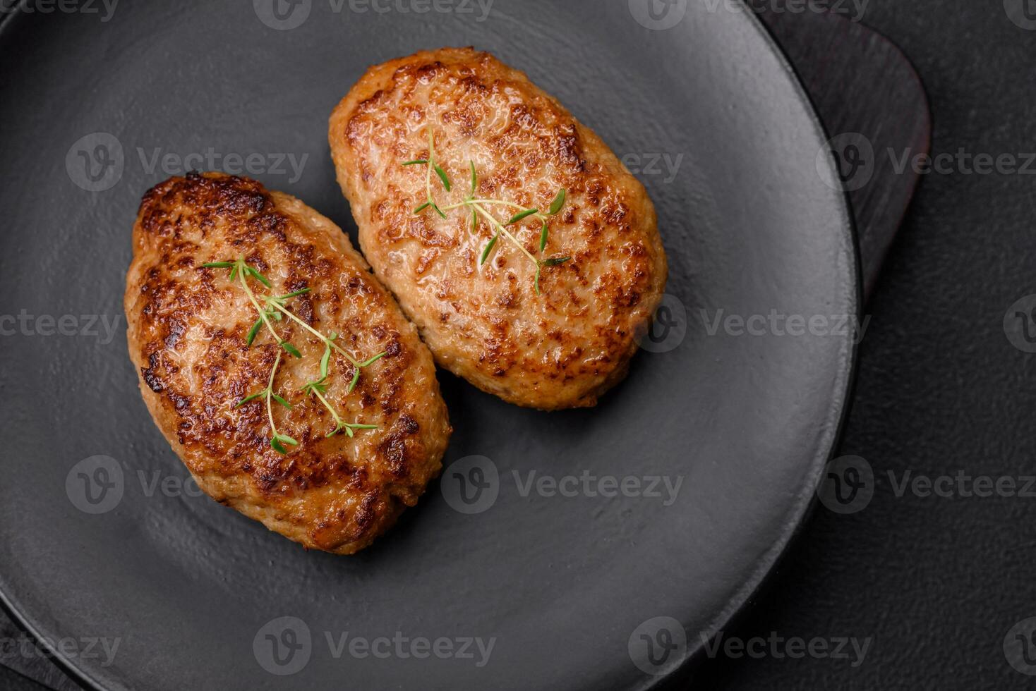 Delicious fresh fried minced fish cutlets with spices and herbs photo