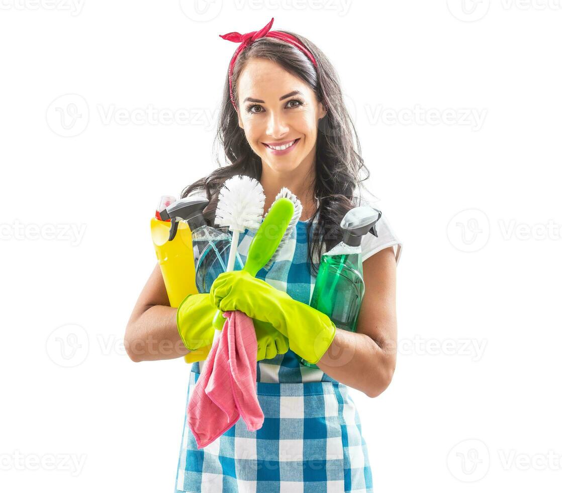 Beuatiful woman on isolated background holding cleaning stuff in her arms photo