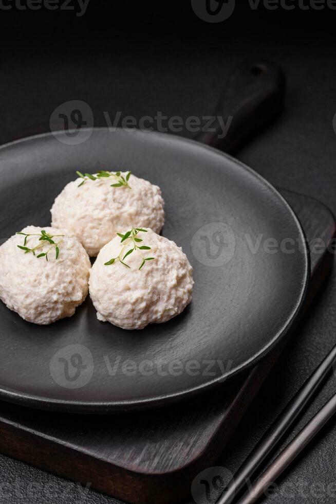 Delicious healthy steamed chicken cutlets or minced meatballs photo