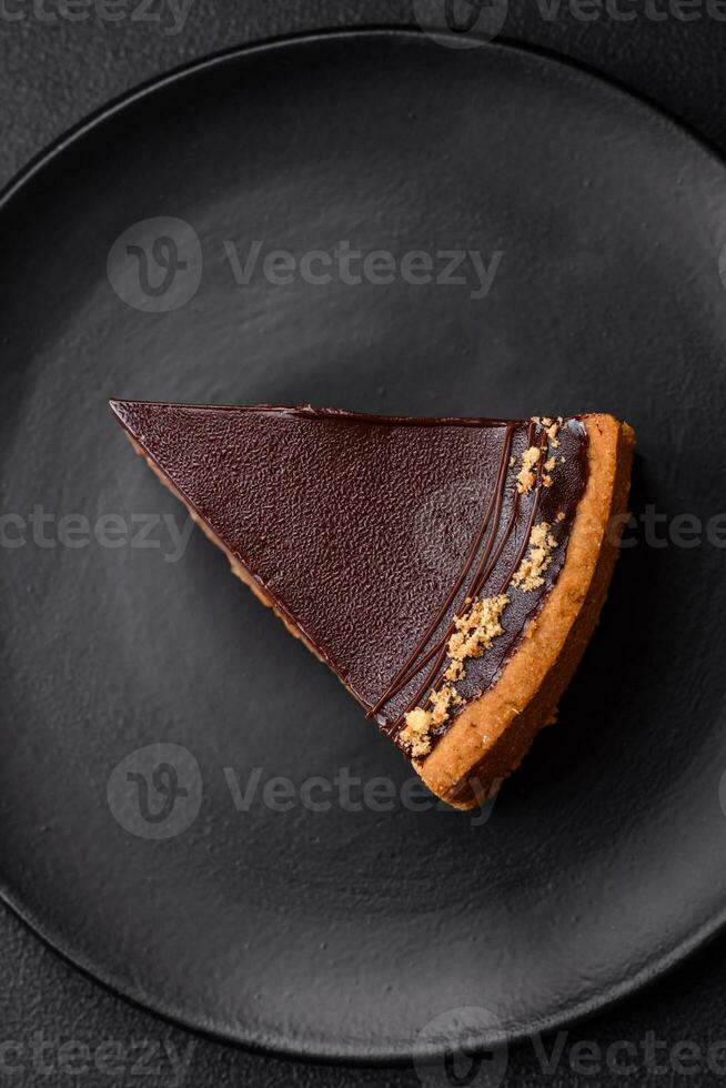 Delicious, fresh, sweet chocolate cake with nuts cut into slices photo