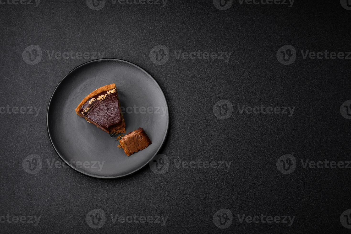 Delicious, fresh, sweet chocolate cake with nuts cut into slices photo