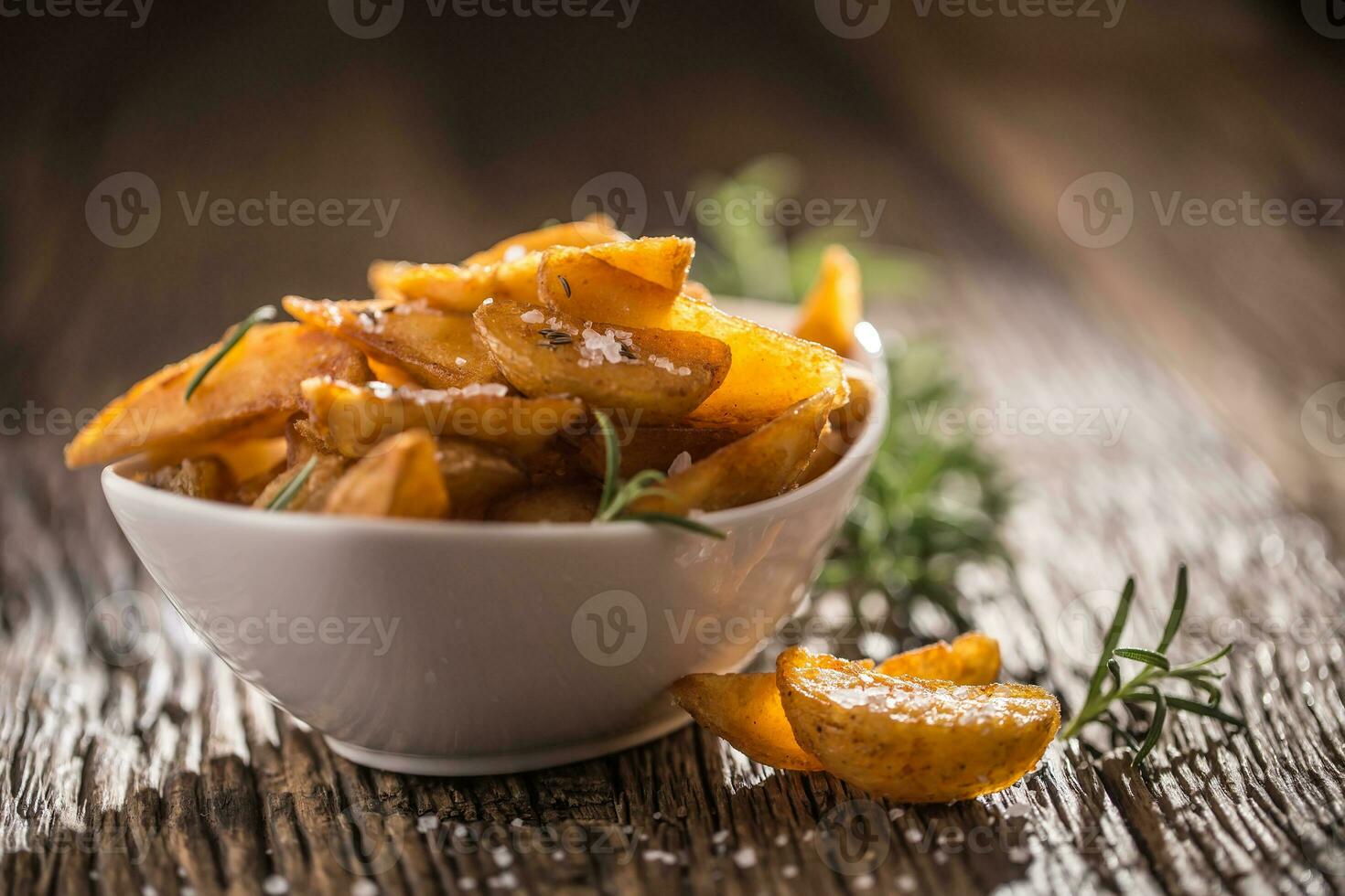 Potatoes. Roasted american potatoes with rosemary salt and cumin photo