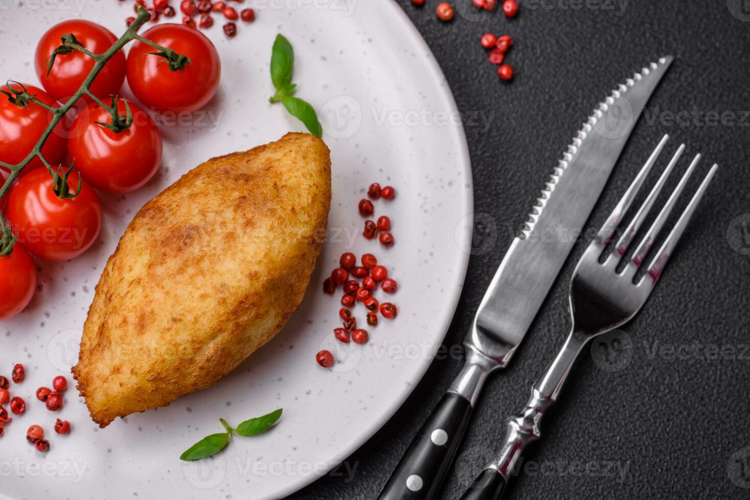 Delicious baked potato cutlet stuffed with chicken and vegetables, spices and salt photo