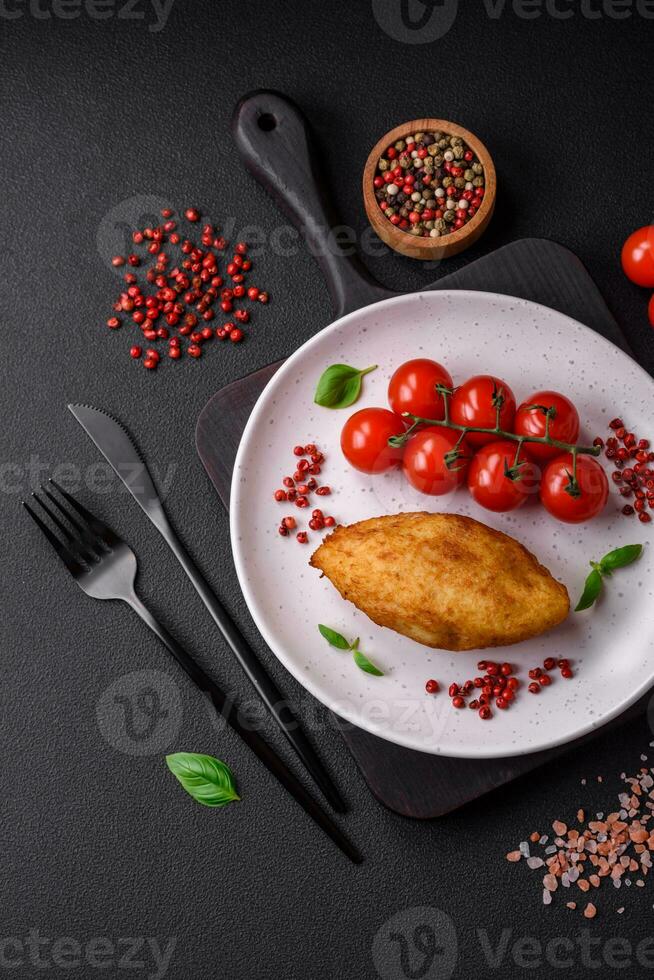 Delicious baked potato cutlet stuffed with chicken and vegetables, spices and salt photo