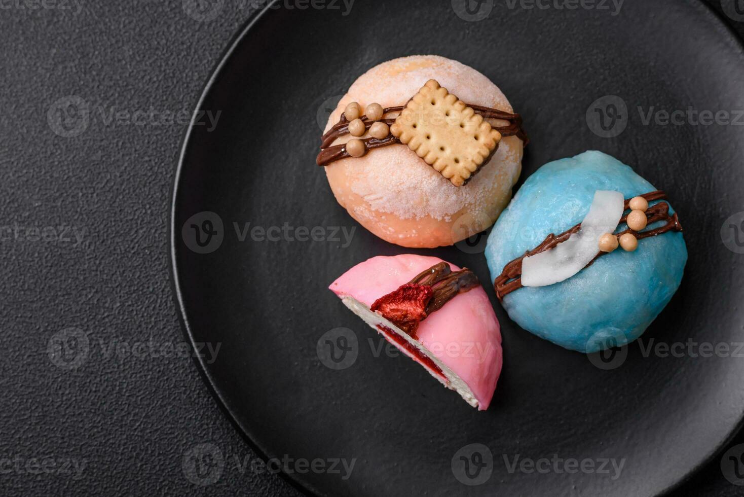 Delicious sweet colorful mochi desserts or ice cream with rice dough and toppings photo