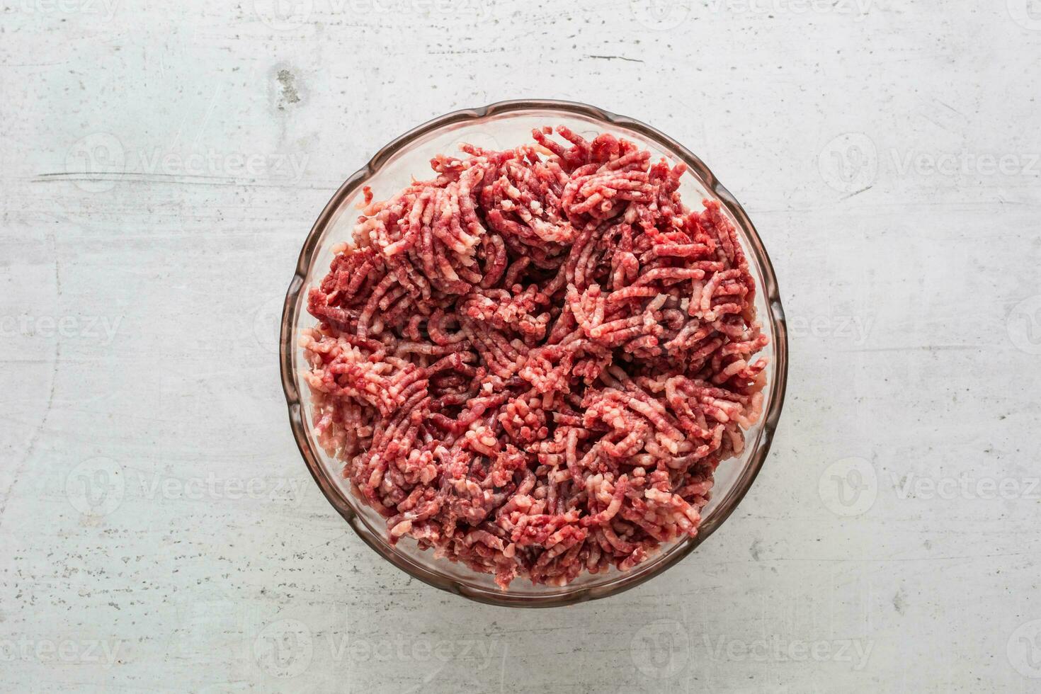 Minced beef pork or lamb meat in a glass bowl photo