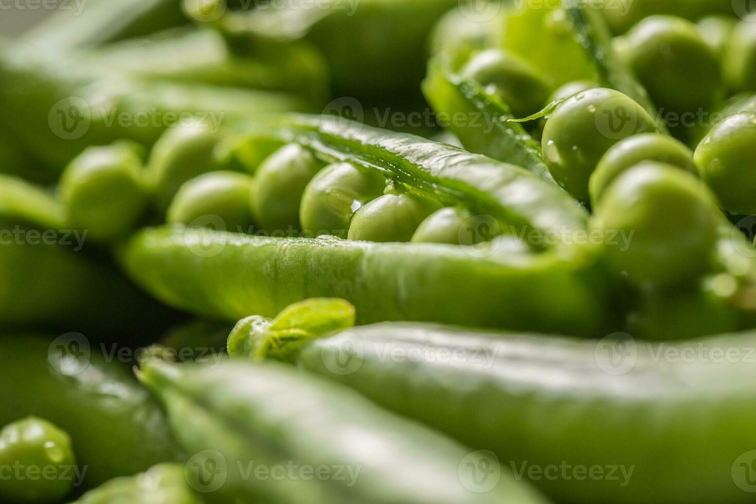 Fresh green pea seeds and pods - Close up photo