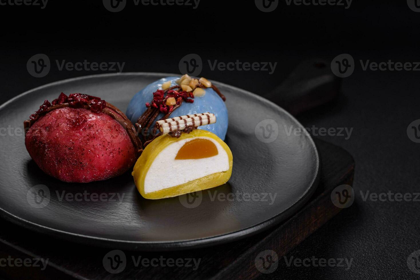 Delicious sweet colorful mochi desserts or ice cream with rice dough and toppings photo