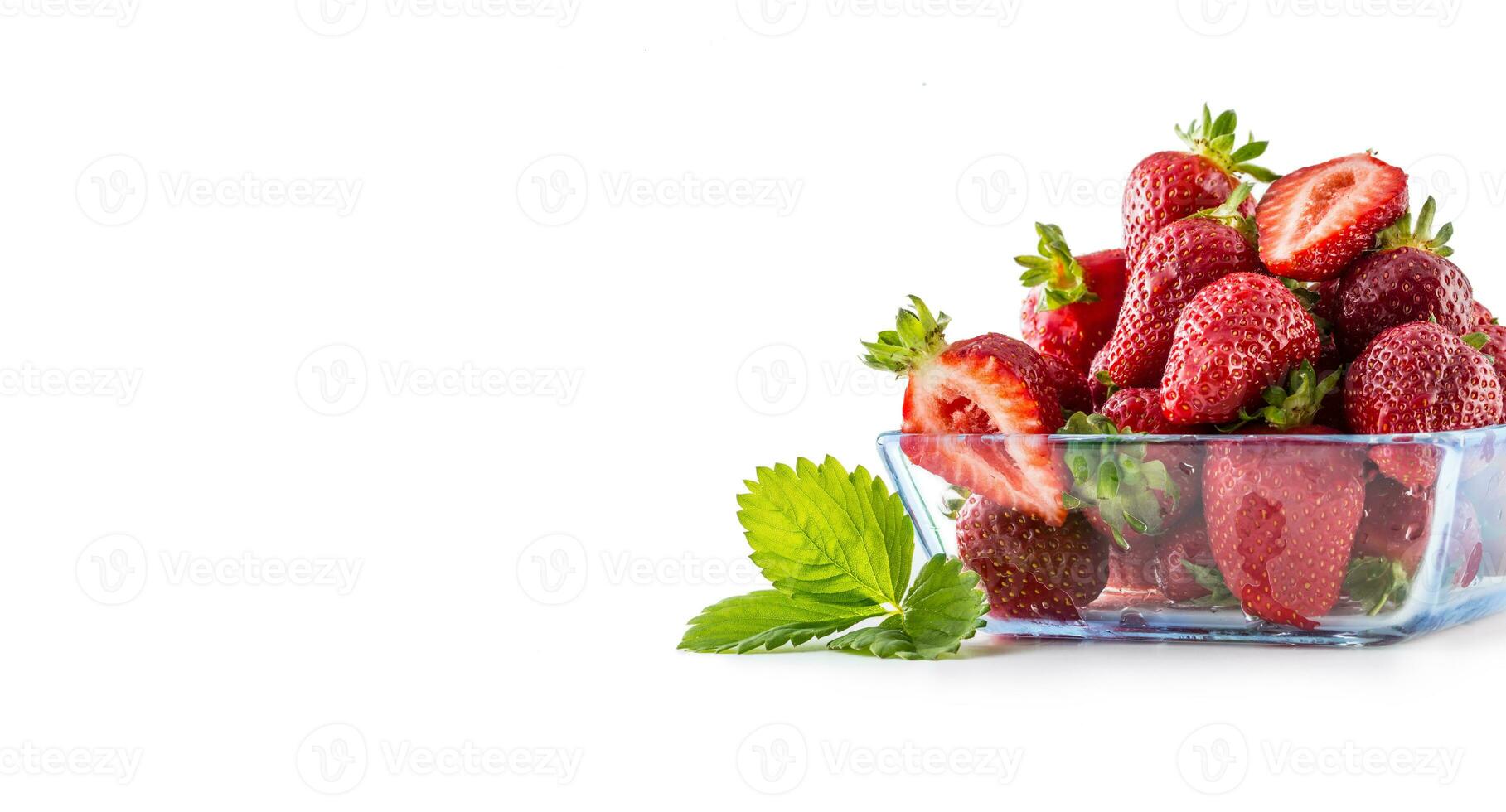 Fresh ripe strawberry in glass bowl isolated on white photo