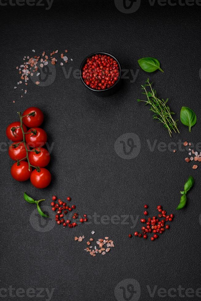 Ingredients for cooking cherry tomatoes, salt, spices and herbs photo