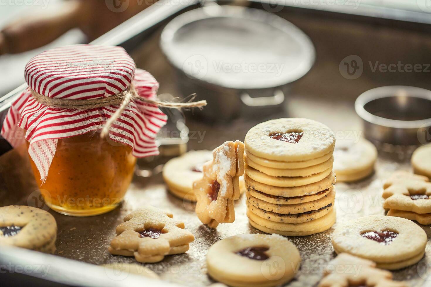 Christmas linzer sweets and cookies marmalade sugar powder in baked pan photo