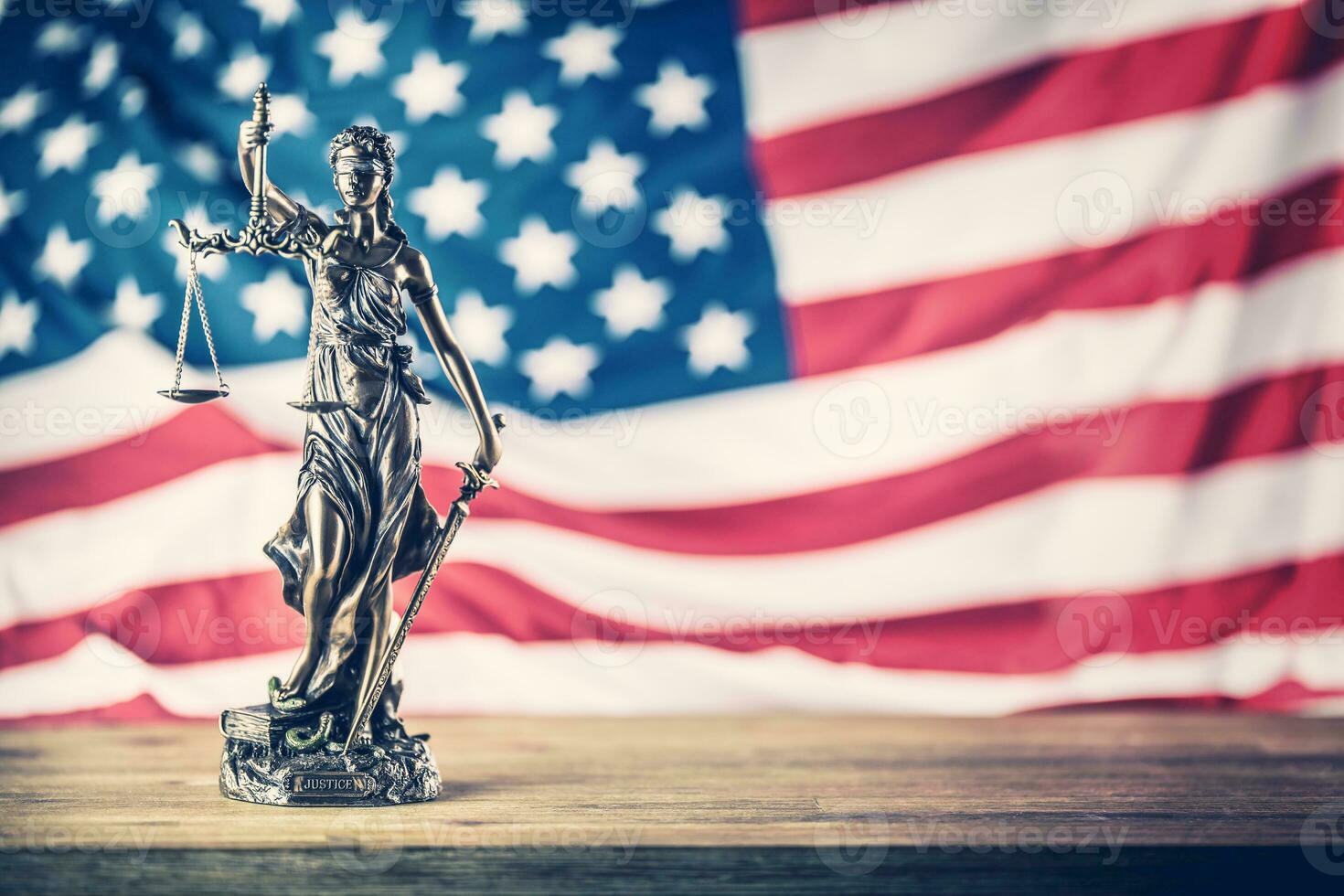 Lady Justice and American flag. Symbol of law and justice with USA Flag photo