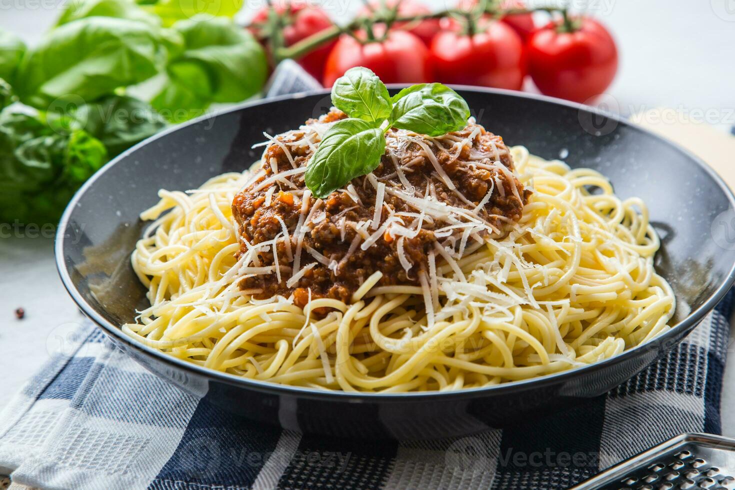 Spaghetti Bolognese. Pasta spaghetti Bolognese with basil and decoration in restaurant or home photo