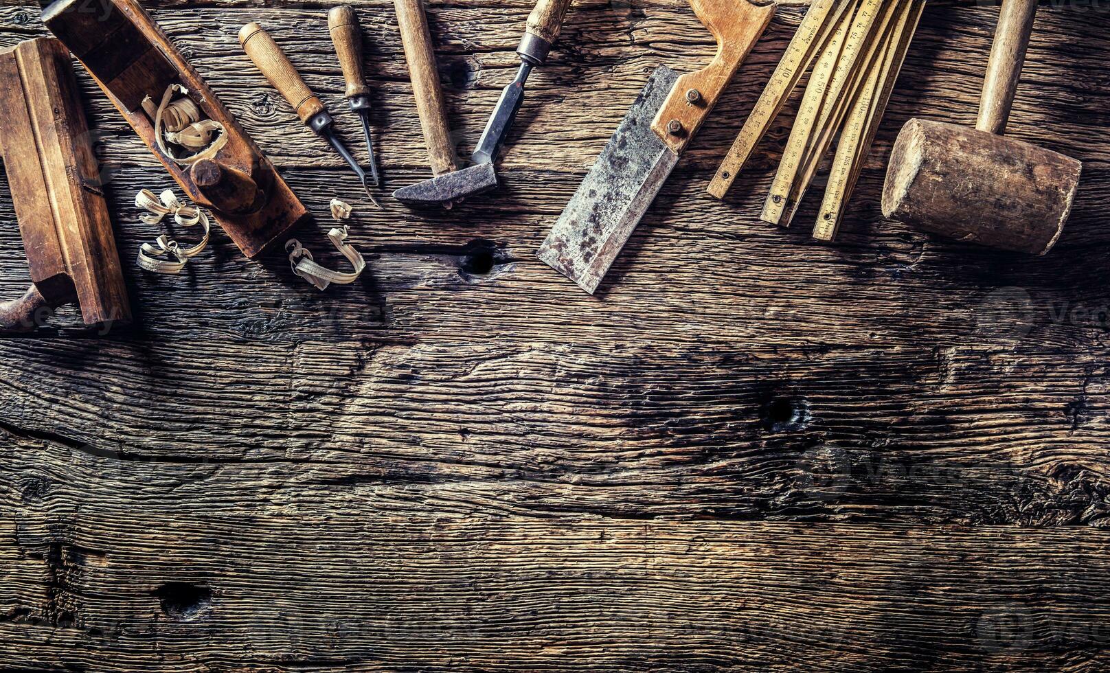 Top of view vintage carpenter tools in a carpentry workshop photo