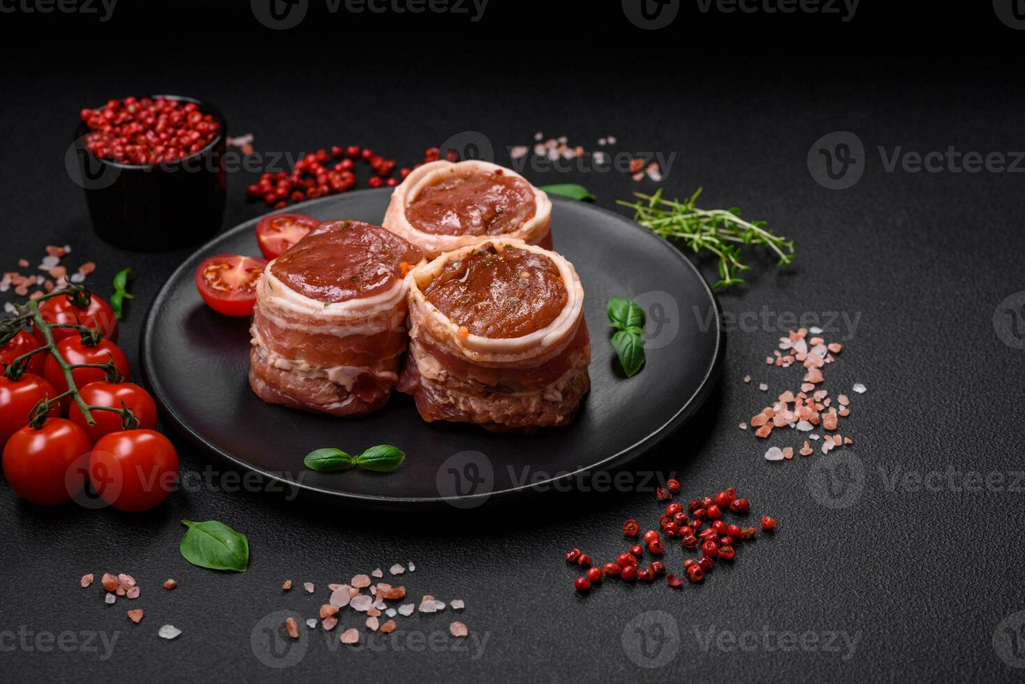 Delicious raw fresh pork or chicken meat rolls wrapped in bacon photo