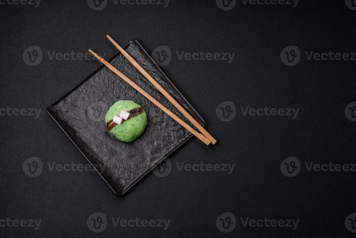Delicious sweet colorful mochi desserts or ice cream with rice dough and toppings photo