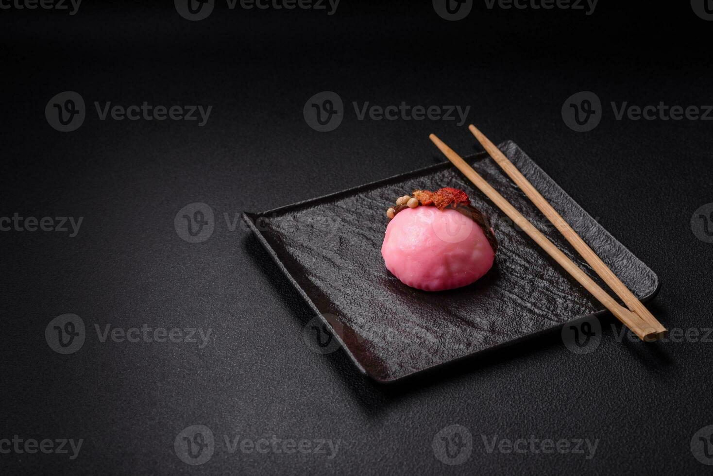 Delicious sweet colorful mochi desserts or ice cream with rice dough and toppings photo