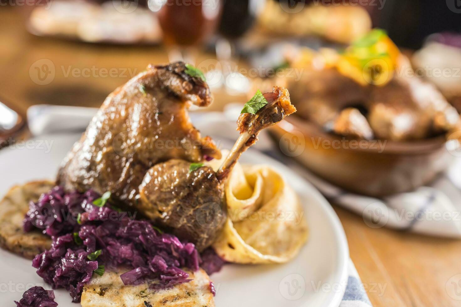 Roasted christmas duck leg red cabbage dumplings liver draft beer and baked buns photo