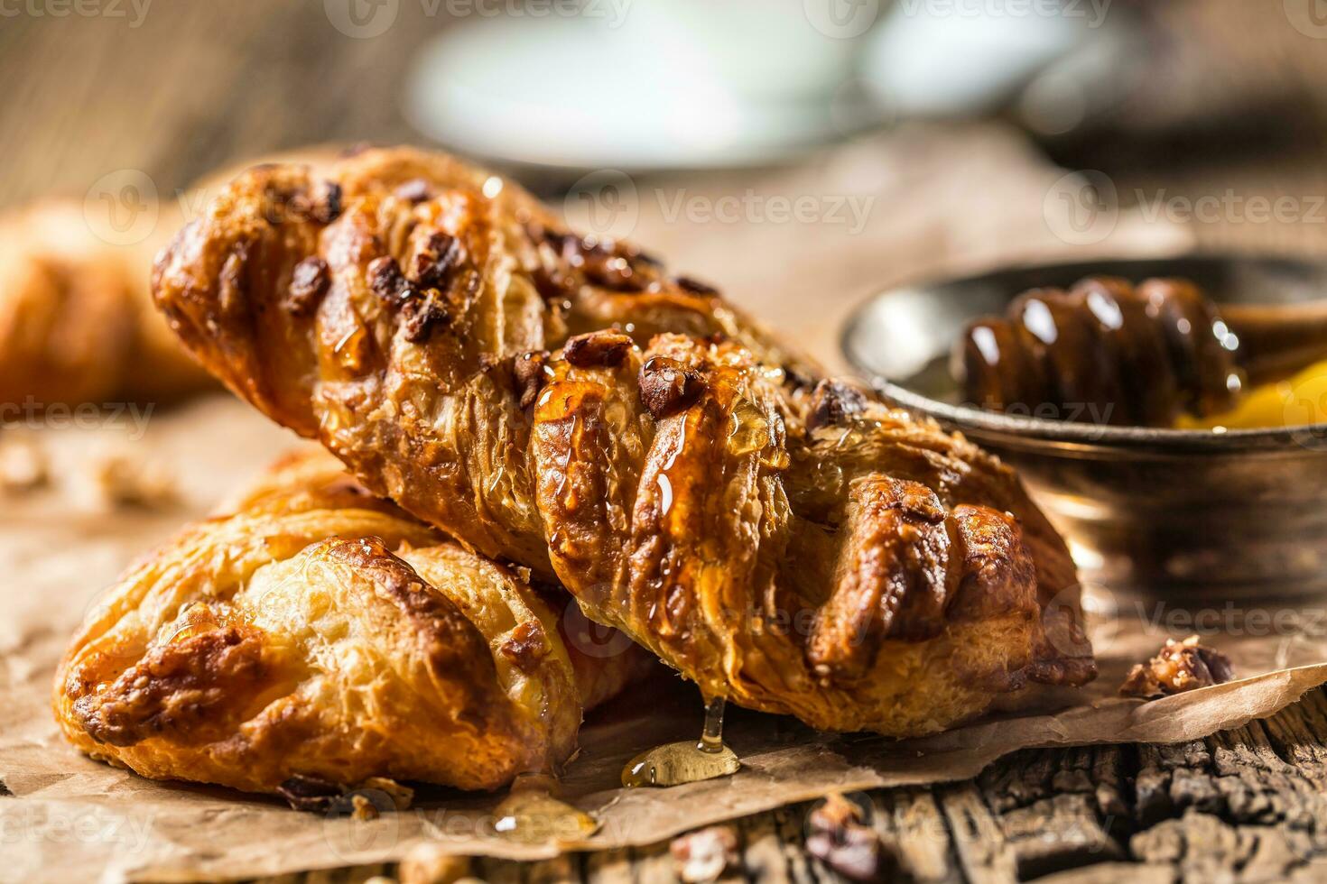 Sweet Pastry. Sweet pie honey cup of coffee on wooden table. Sweet breakfast photo