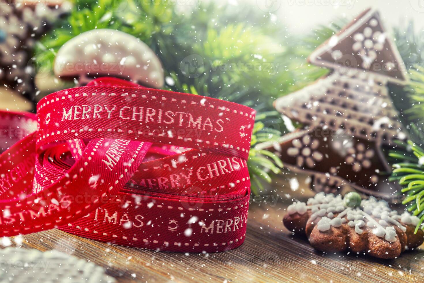 Christmas. Christmas ribbon pastry gingerbread and decoration in snowy atmosphere photo