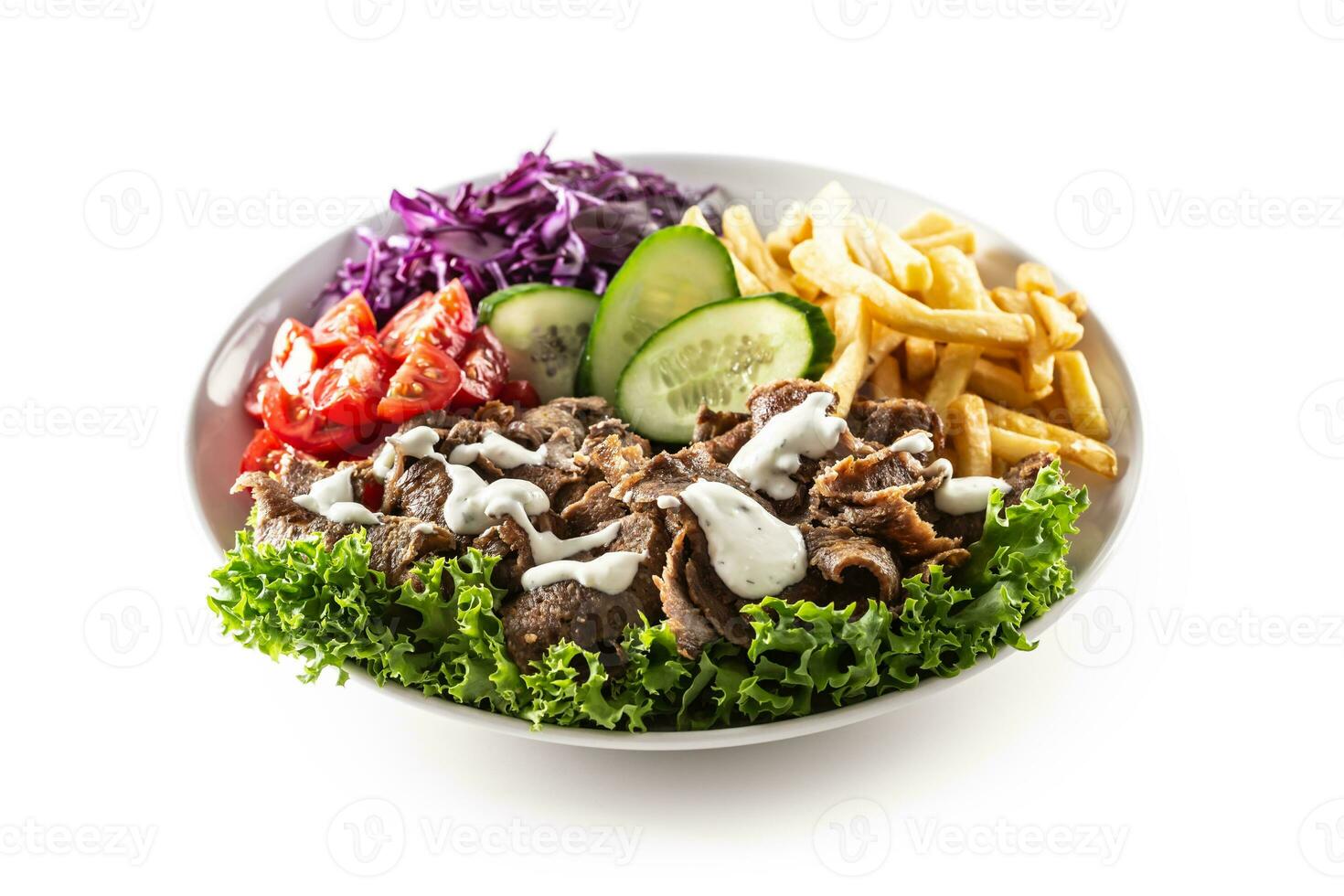 Savory Turkish veal kebab served with fresh vegetables, letuce, french fires and lovely and delicious dip, mayonnaise photo