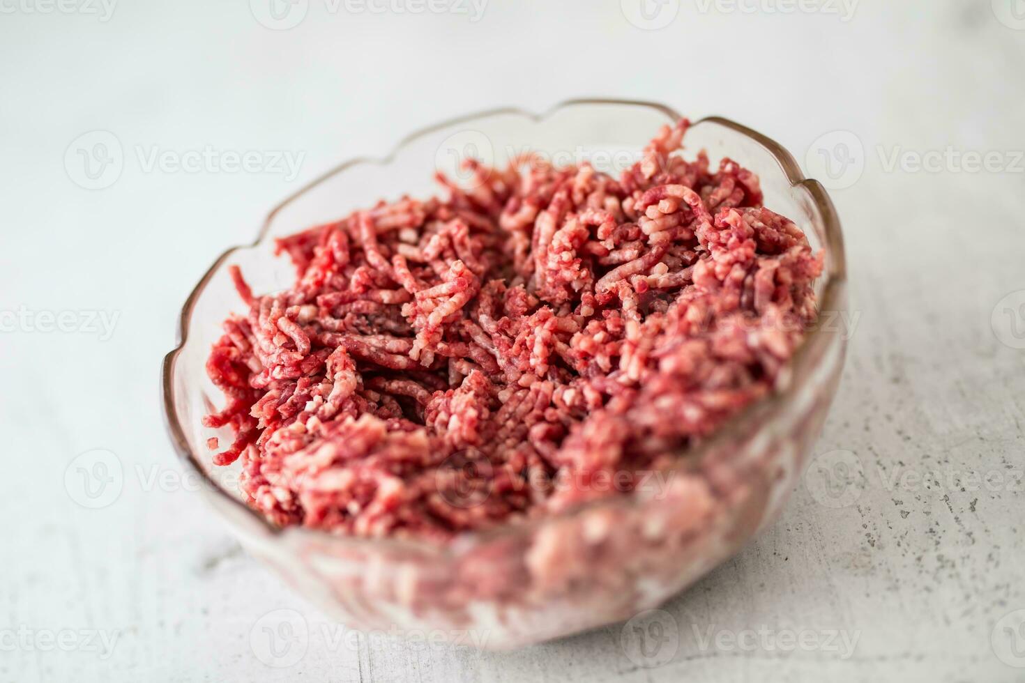 Minced beef pork or lamb meat in a glass bowl photo