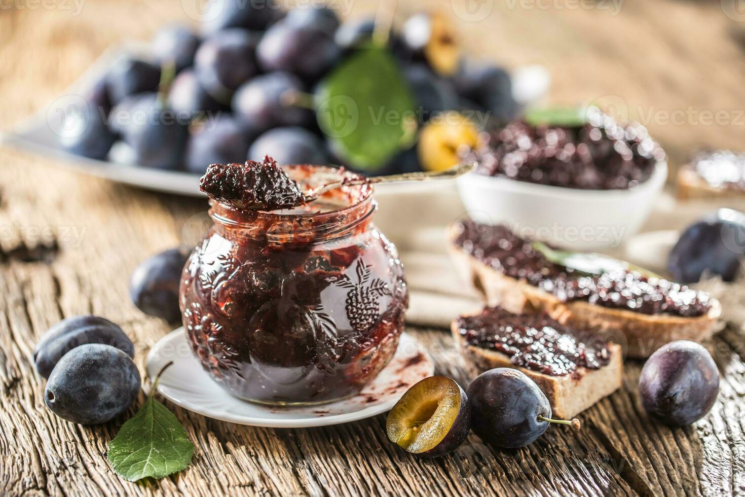 Breakfast from homemade plum jam bread and ripe plums. photo