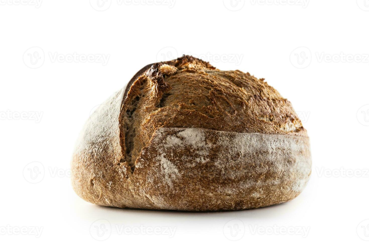 Isolated freshly baked crunchy yeast bread loaf lying on the table photo