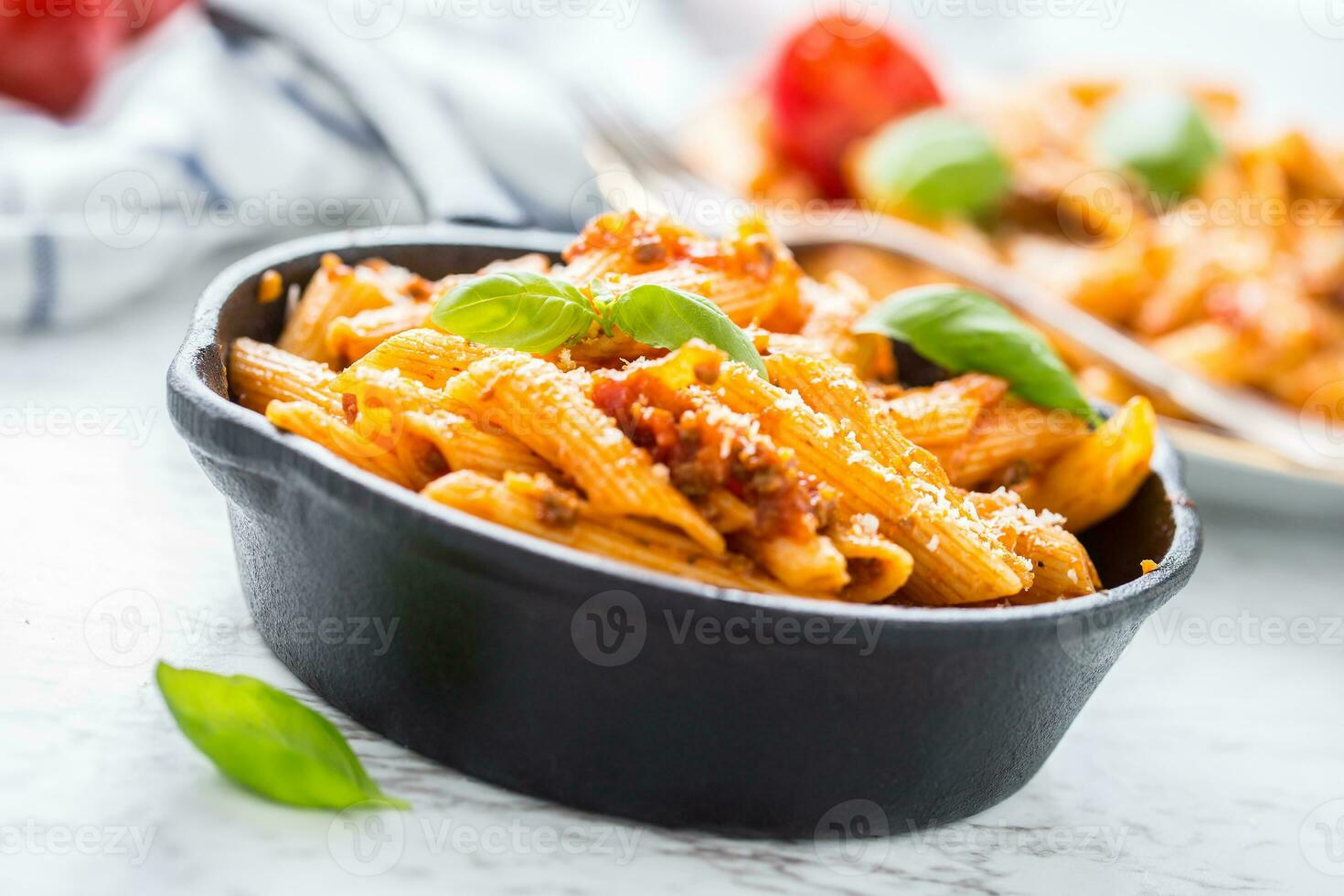 Italian food and pasta penne with bolognese sause in pan photo