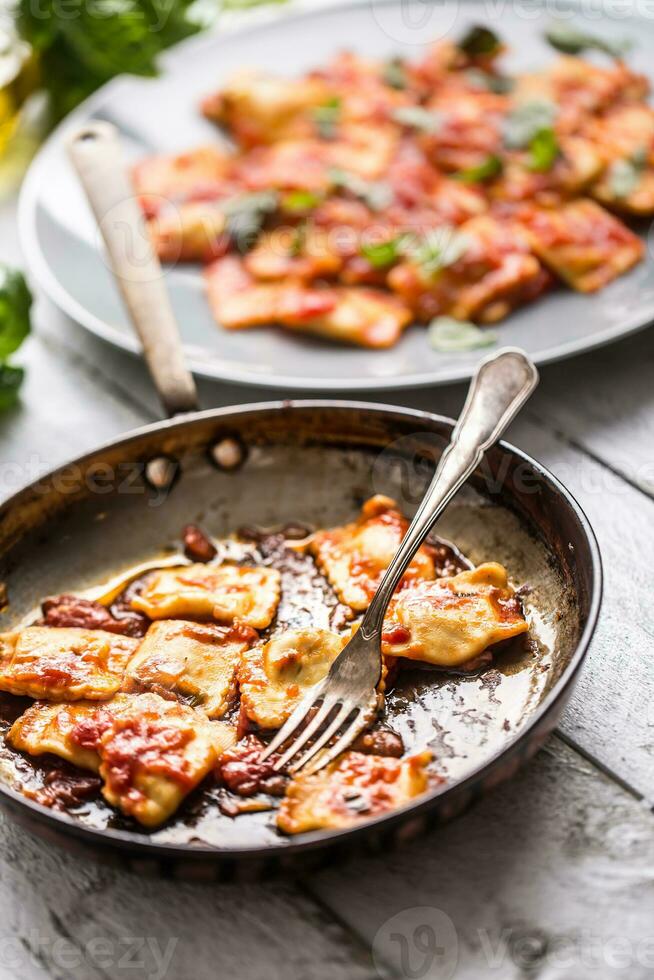 Italian or mediterranean food pasta ravioli of tomato sauce. photo