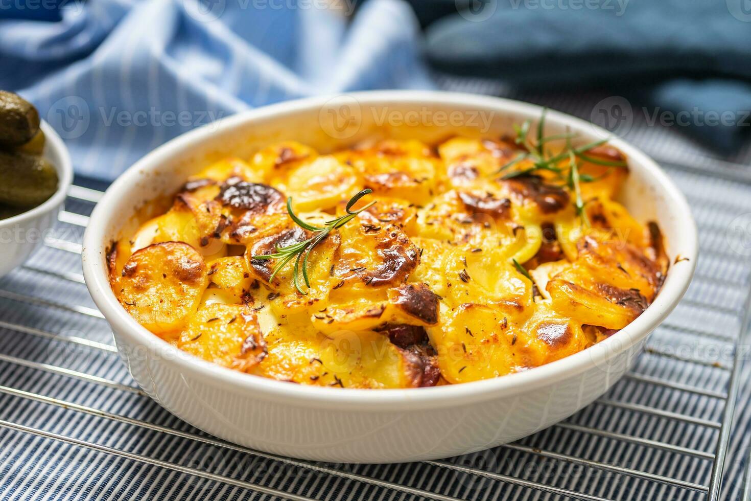 Roasted potatoes in baking dish traditional easten european food titled as france potato photo