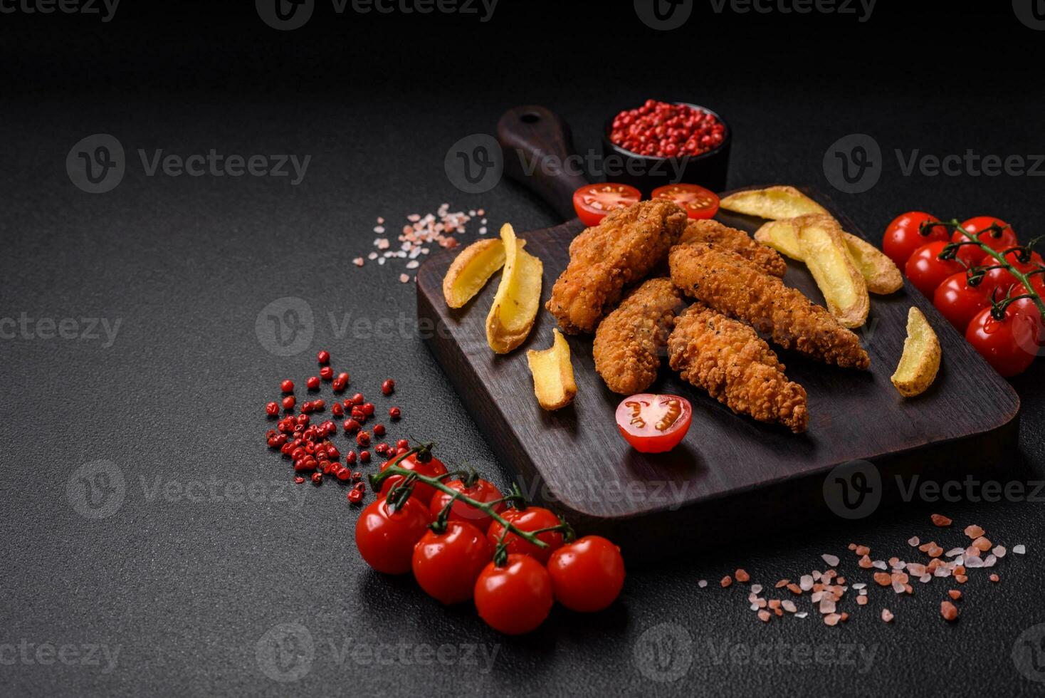 Delicious crispy chicken nuggets breaded with salt and spices photo