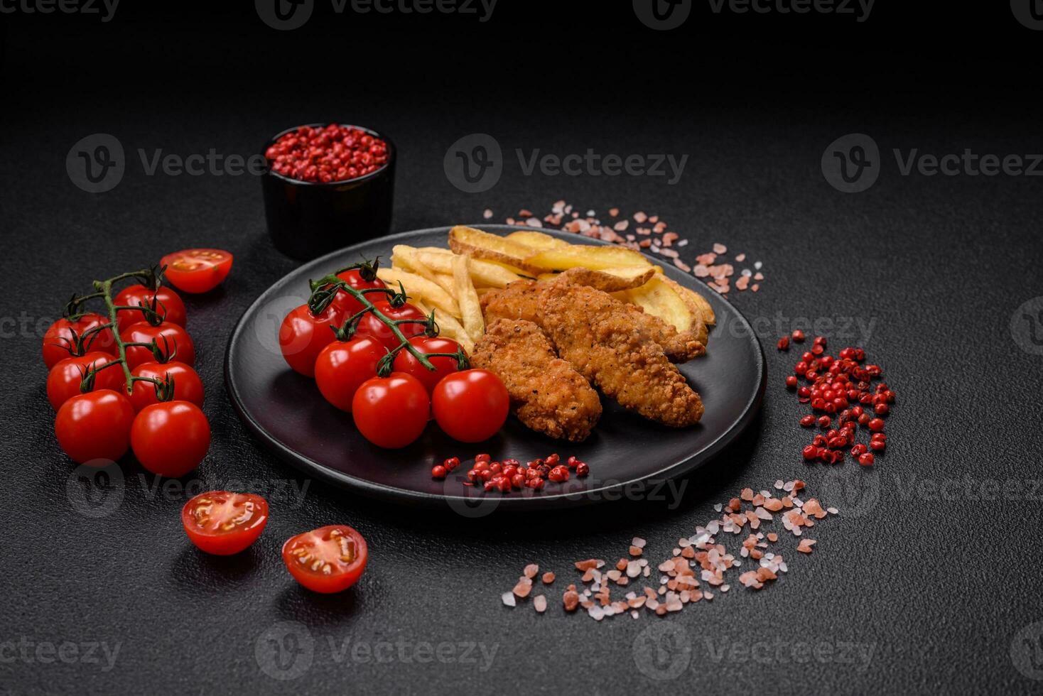 Delicious crispy chicken nuggets breaded with salt and spices photo
